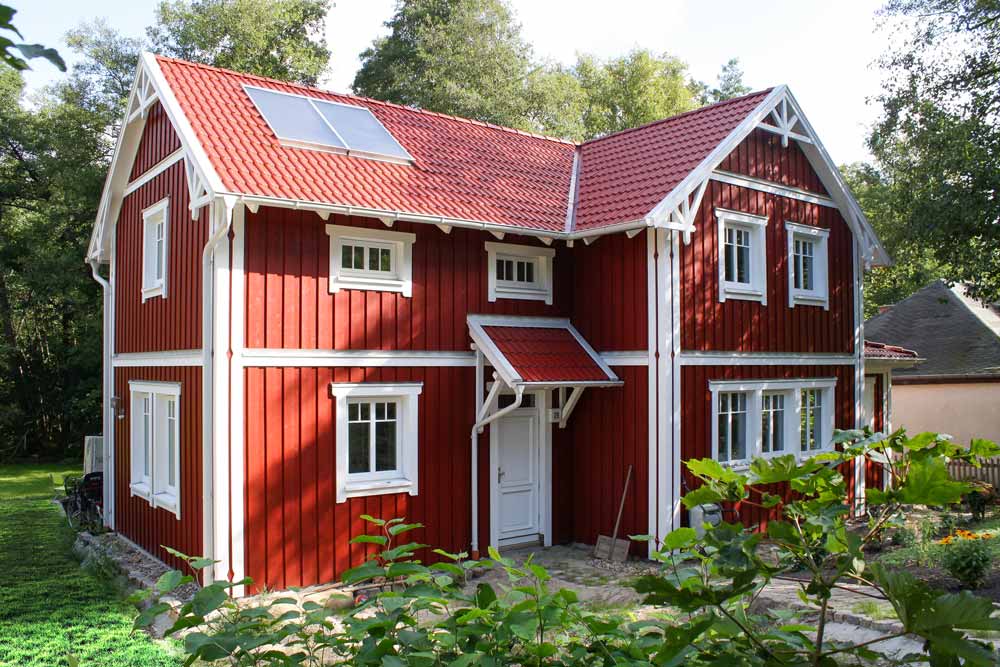 Wohngesundes Schwedenhaus - Eine große Wiese vor einem Haus - Schwedenhaussiedlung Unna