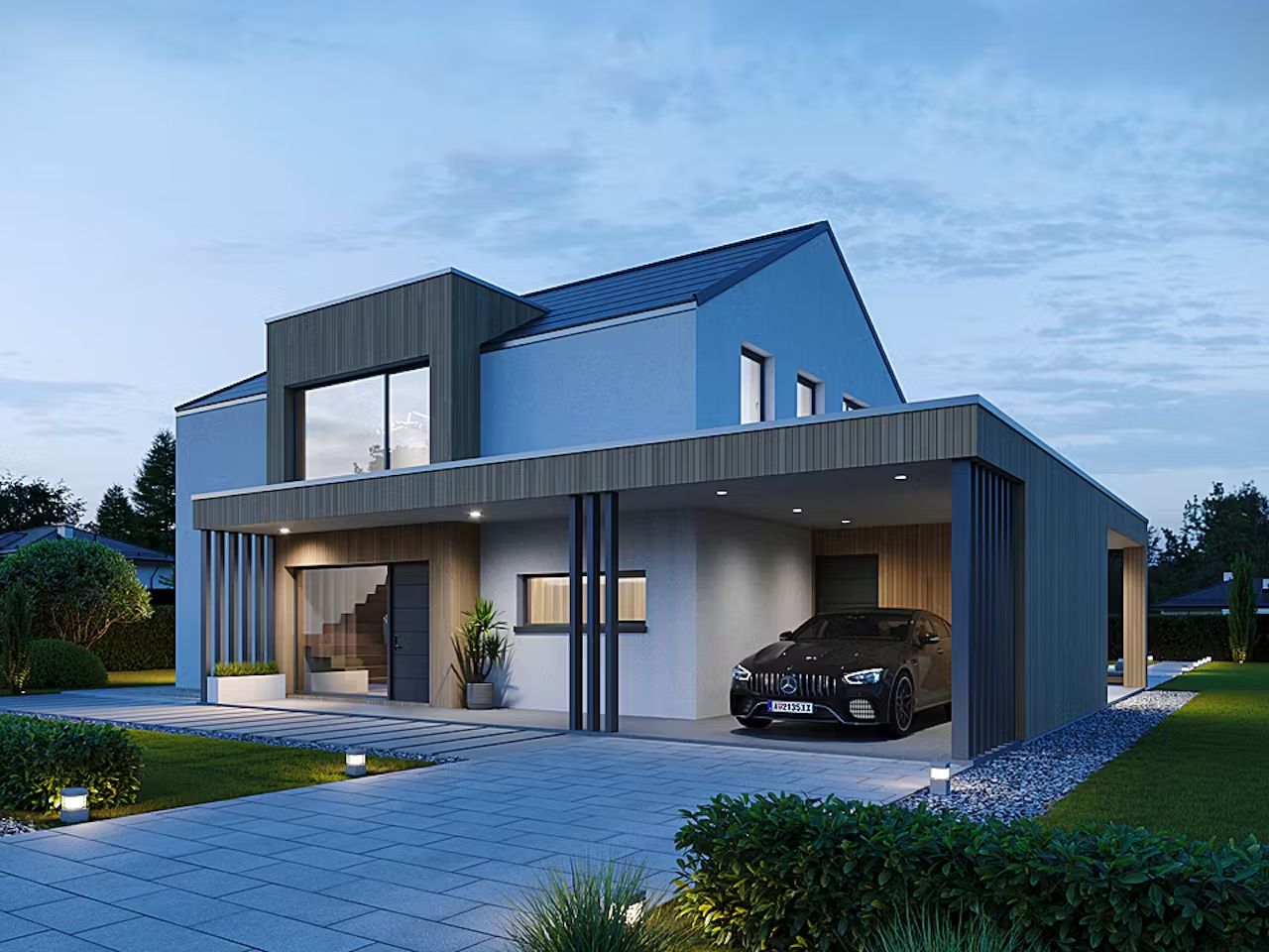 Hier sehen Sie ein modernes Satteldachhaus mit Vordach und Carport im Dämmerlicht, das Haus hat Innenbeleuchtung an.