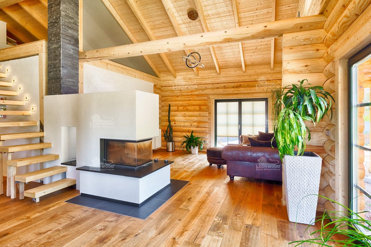Haus Espoo deluxe - Ein Wohnzimmer mit Möbeln und einem Kamin - Holzhaus