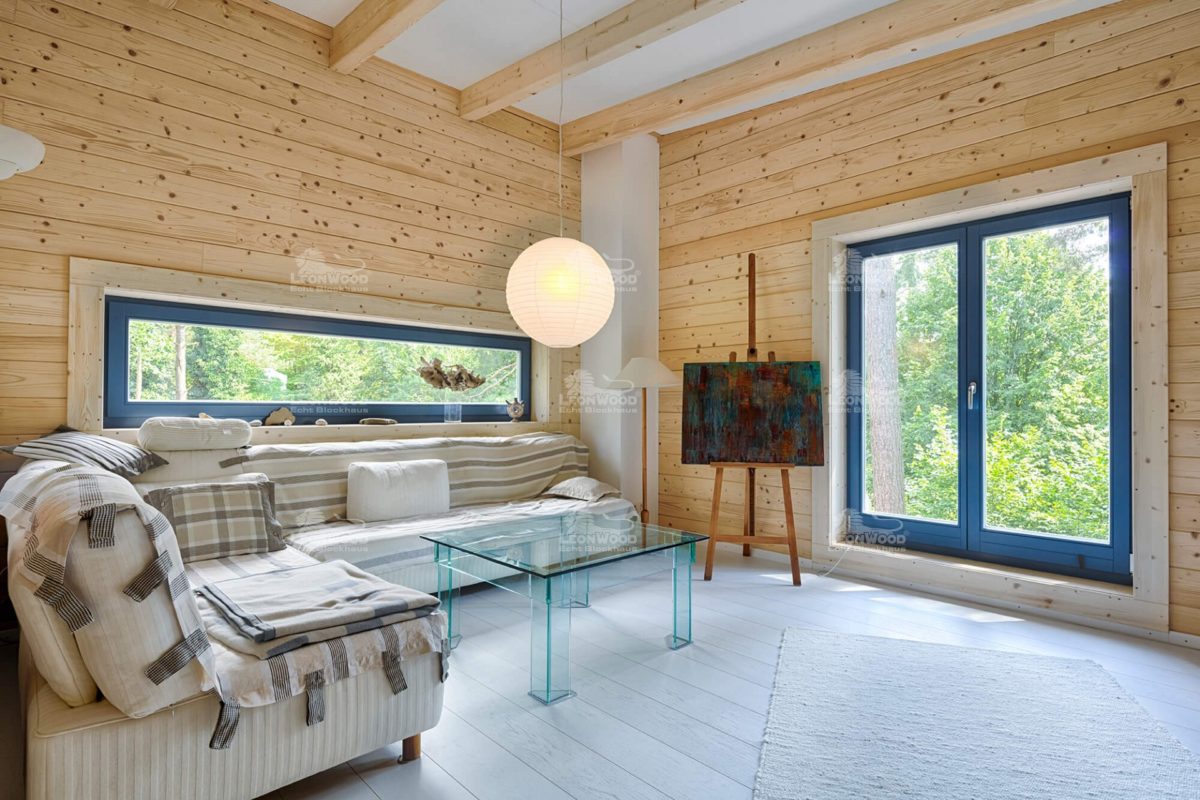 Blockhaus Kalevala - Ein Raum voller Möbel und ein großes Fenster - Küche