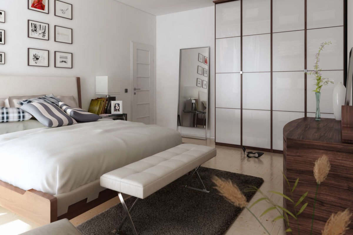 Komfort - Ein Schlafzimmer mit einem Bett und einem Schreibtisch in einem Raum - Interior Design Services