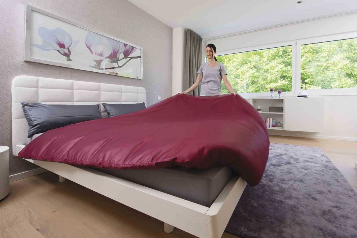 CityLife Haus 700 - Ein Schlafzimmer mit einem Bett in einem Raum - WeberHaus