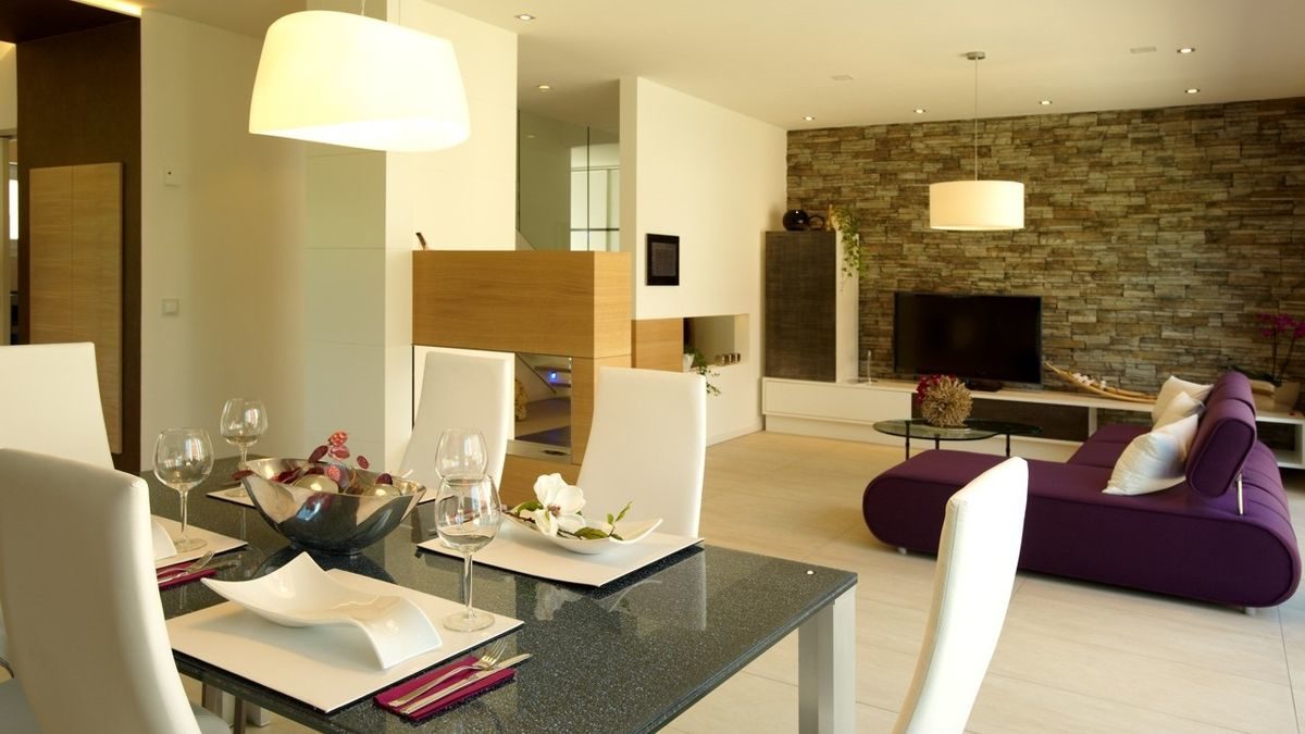 Energie-Plus-Haus Generation X - Ein Wohnzimmer mit Möbeln und einem Tisch - Haus