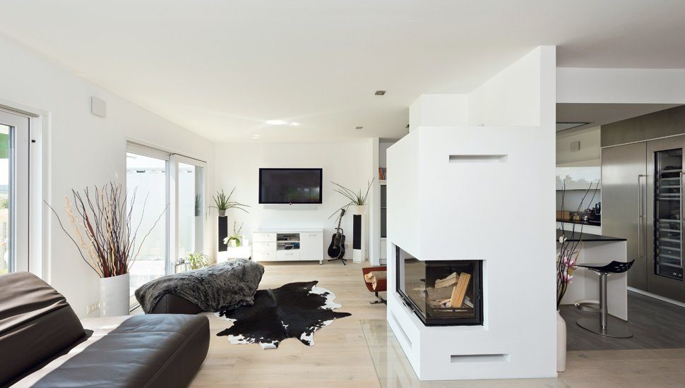 Luxhaus Haustest - Ein Wohnzimmer mit Möbeln und einem Flachbildfernseher - Luxhaus