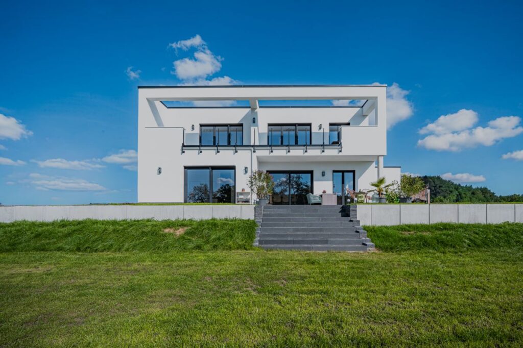 RheinMassiv GmbH Hausbau Helden Rheinmassiv Haus mit Flachdach